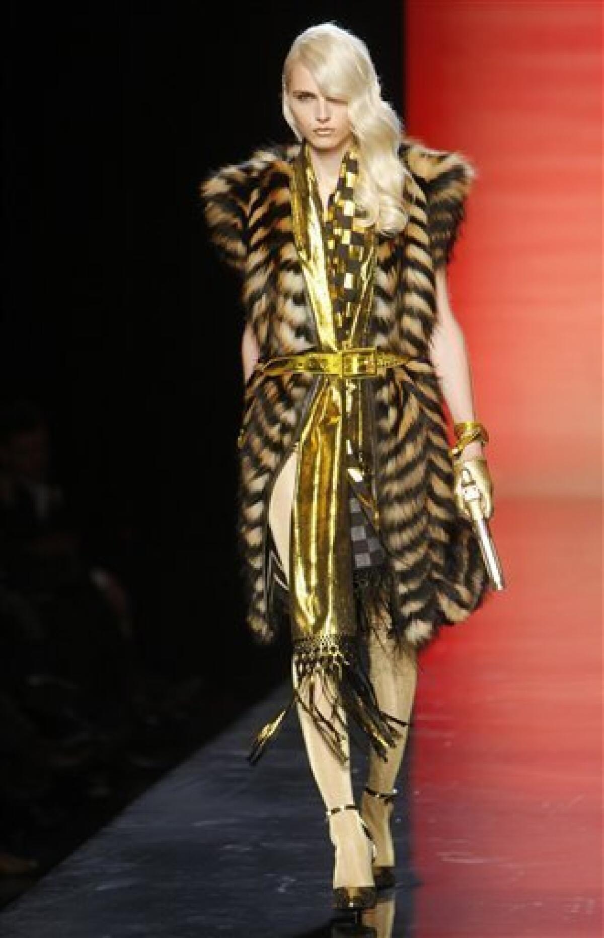 Gaultier reveals the hidden, feminine side of 007 - The San Diego